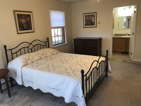 Master bedroom with queen bed, two large closets, and full bath.
