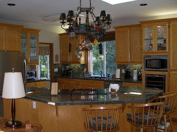 Remodeled Kitchen w/ Slate backsplash, granite countertops and so much more