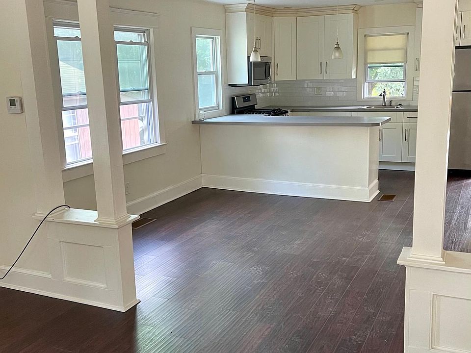 Living room, dining room, kitchen with all new hardwood floors.