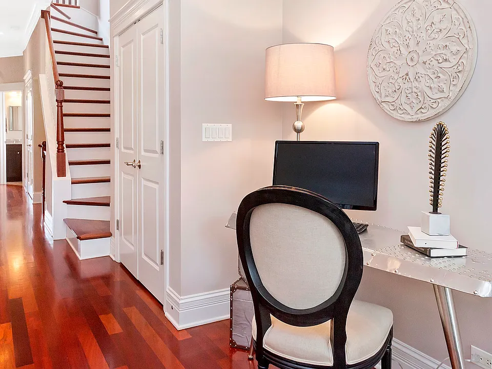 The adorable office nook in the living room is perfect for an office, bar, or hobby area.