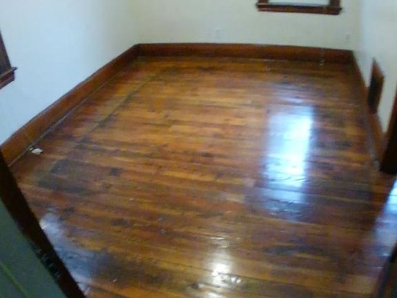 Bedroom 1 with fresh hardwood floor refinish