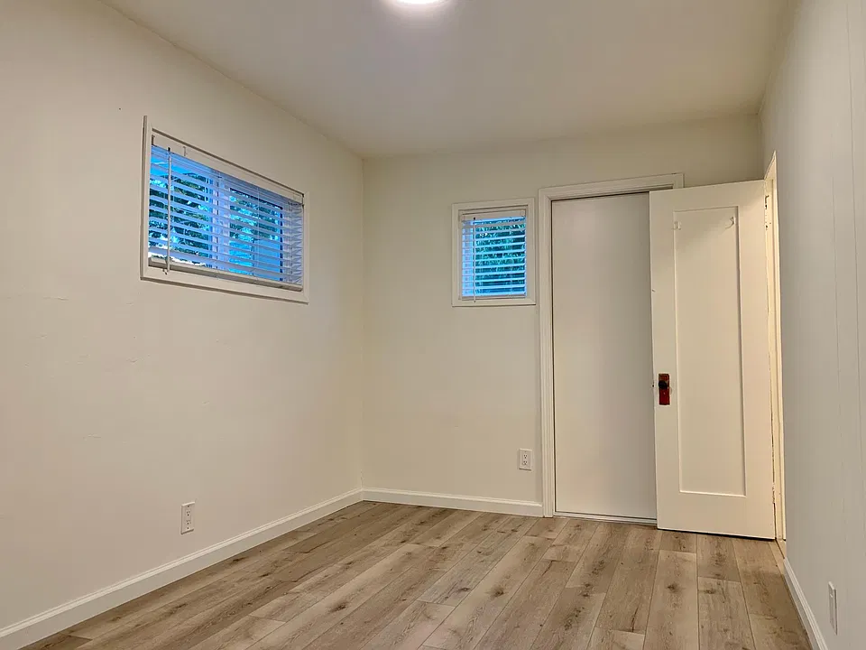 Bedroom; stock photos. Available unit has luxury vinyl "wood" plank flooring throughout except in the bathroom.