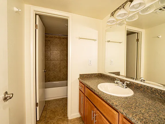 Apartment bathroom — representative home at Fairway Vistas Condominiums.