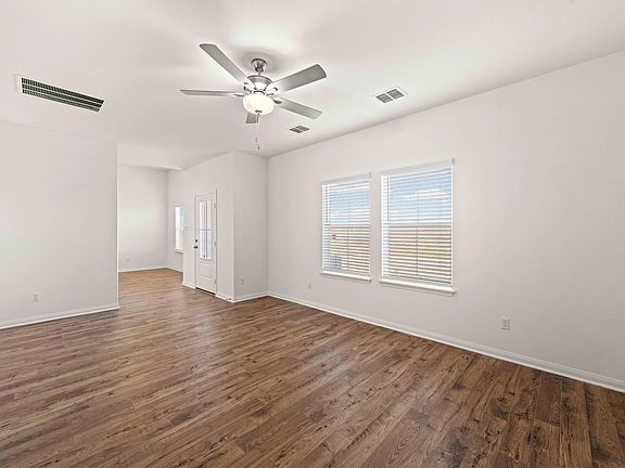Spacious family room with vinyl flooring