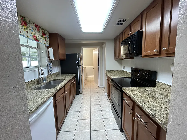 kitchen with fridge, stove, microwave, dishwasher