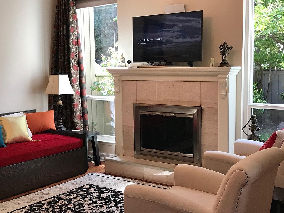 Living room with wood burning fireplace