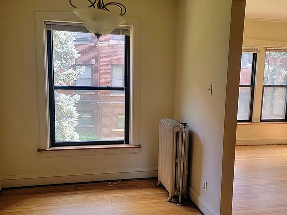 dining room with view of living room to the right from kitchen
