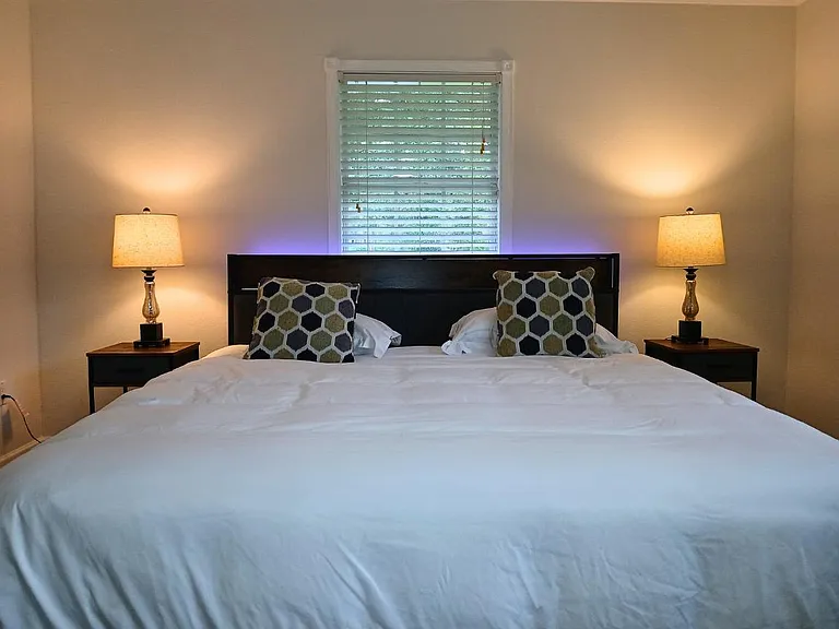 King size bed with upholstered headboard