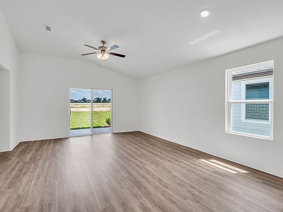 The spacious family room lets in a gorgeous amount of bright, natural light