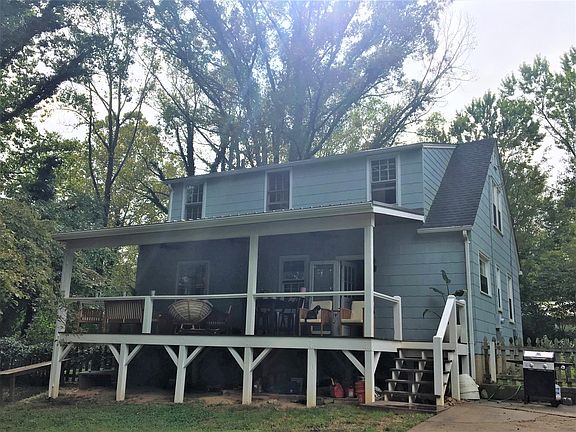 Wonderful covered back deck overlooking the private fenced backyard.