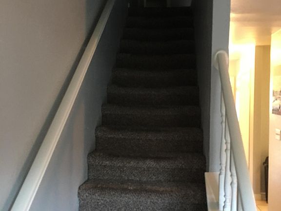Linen closet at the top of the stairs.