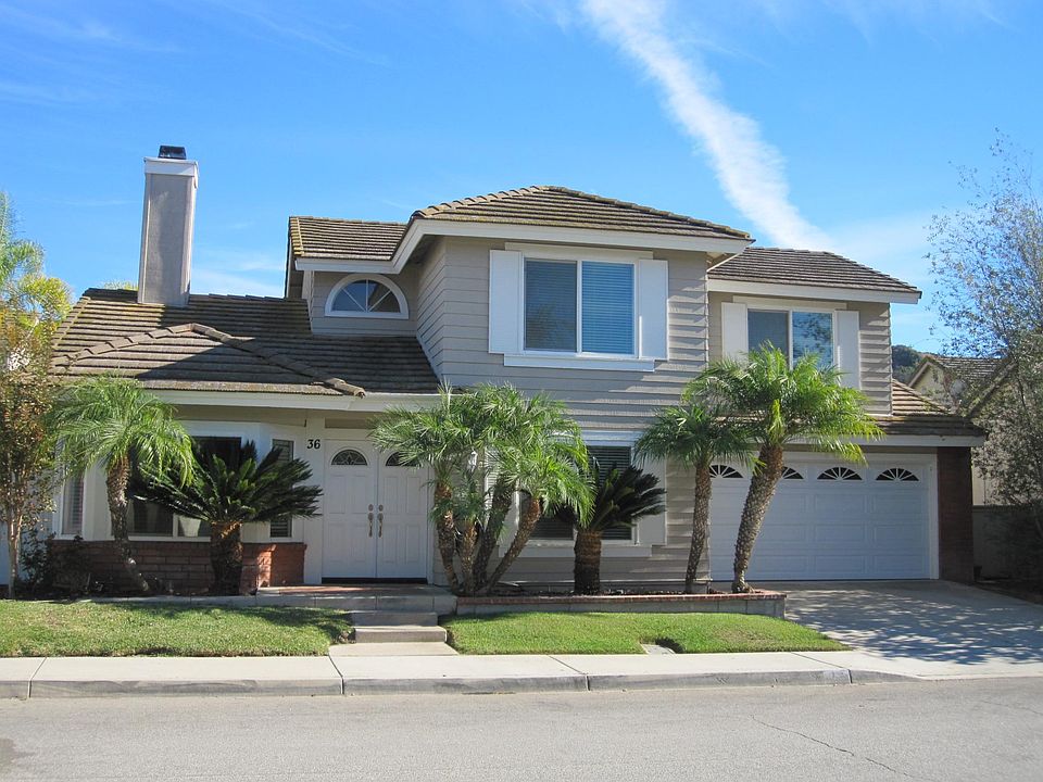 FRONT OF HOME WITH A 2 CAR DRIVEWAY.