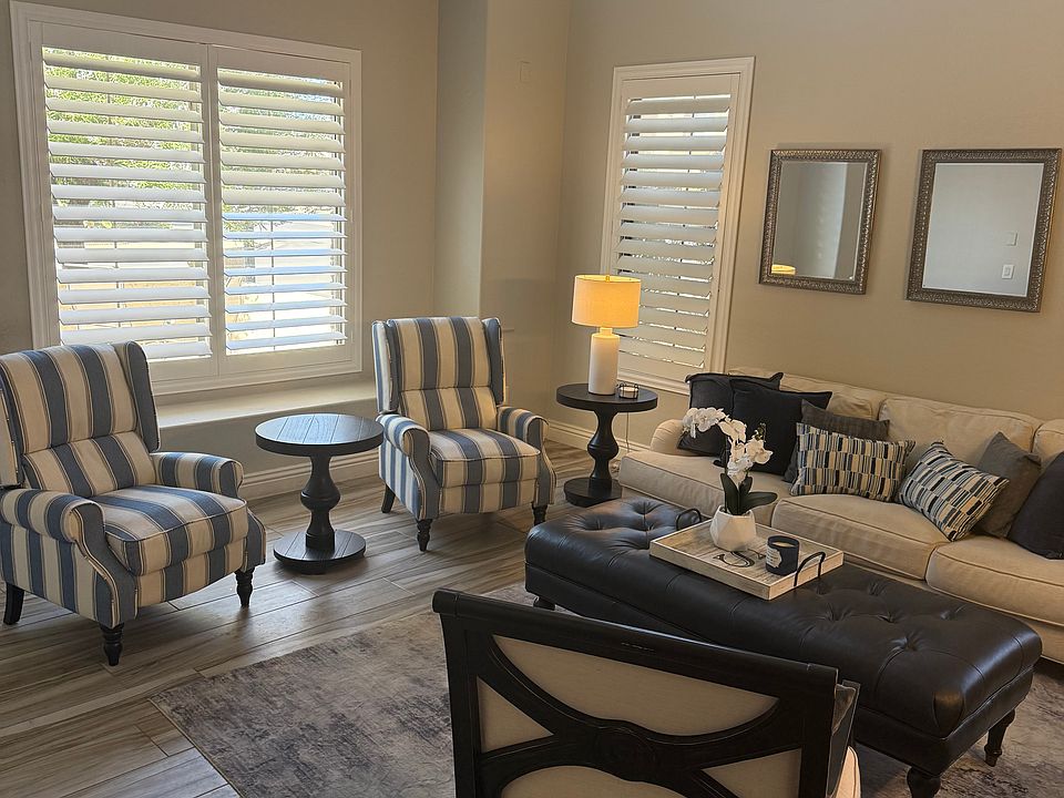 Formal living room as you come in the front door. This room is across from the home office.