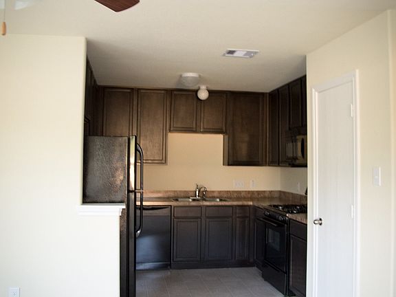 Contemporary kitchen with cabinets galore! All new Energy St