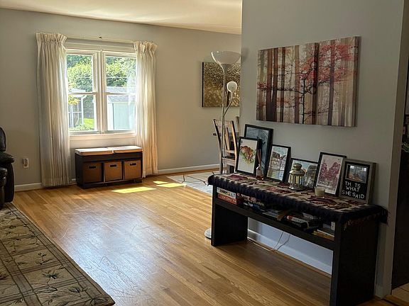 Hall between living area, dining area, and kitchen