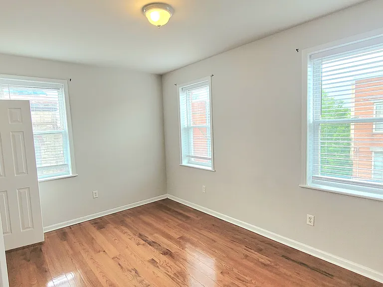 Sun-filled room ideal for office or casual living space.