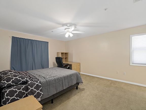 Master bedroom with queen-sized memory foam bed, study area and plenty of space