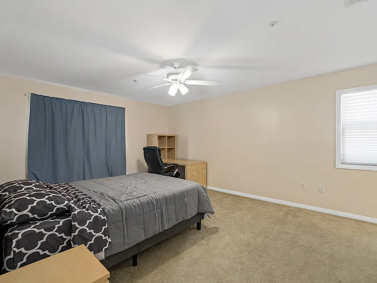Master bedroom with queen-sized memory foam bed, study area and plenty of space