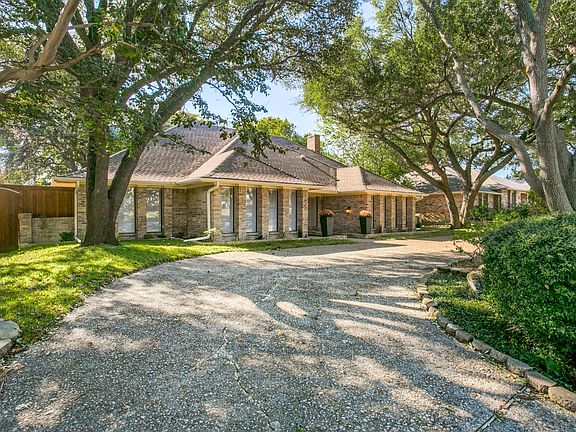 Circle driveway welcomes you to this stately home.