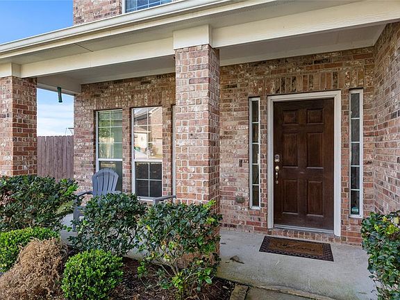 Covered front porch and solid wood front door