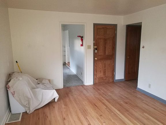 Living room, entrance to kitchen, main entry, closet and hal