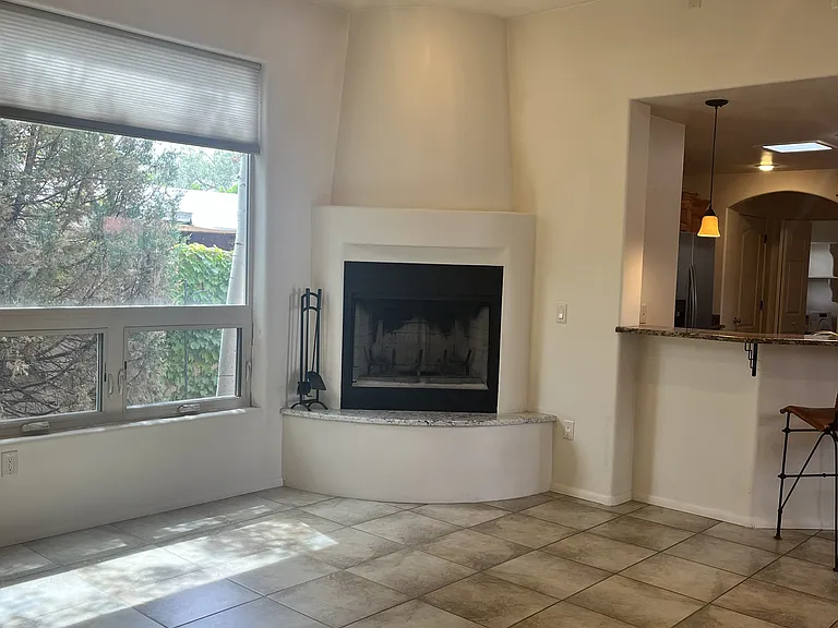 Living Room with wood burning fireplace.
