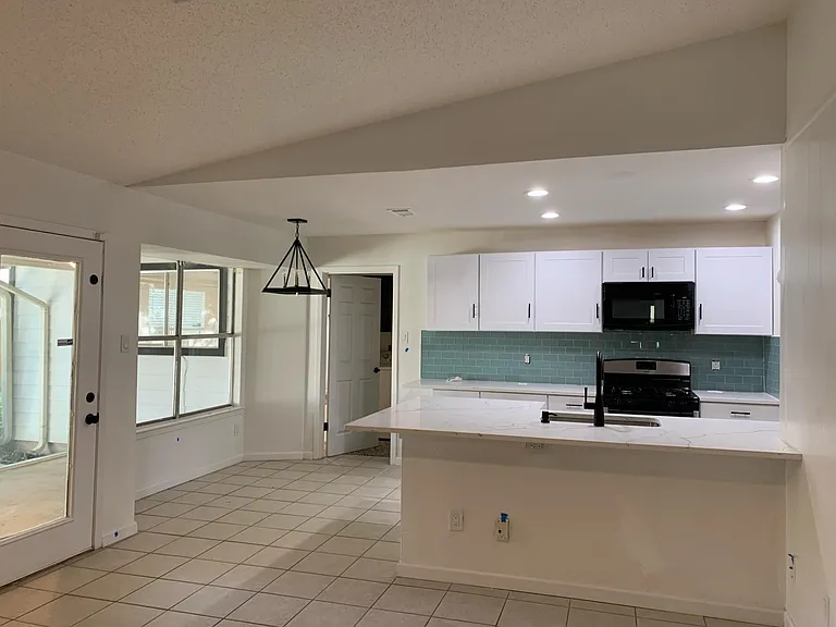 Kitchen with breakfast area and eat in island