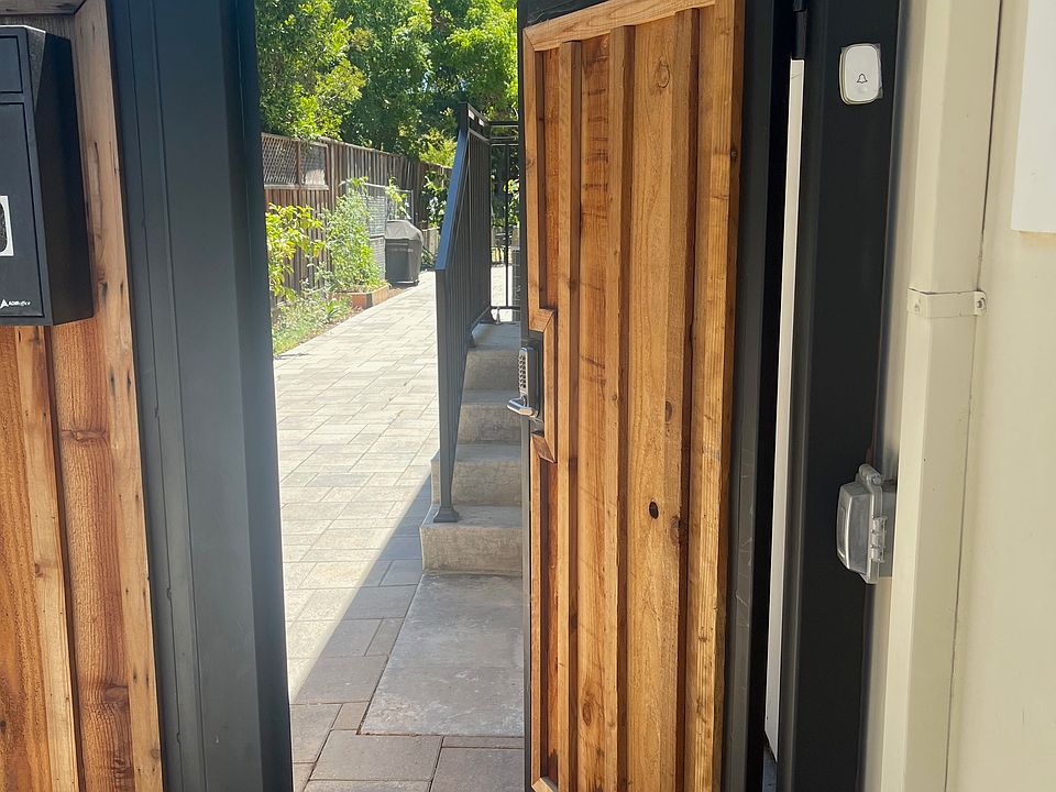 Entrance gate with key code and door bell ring to upstairs.