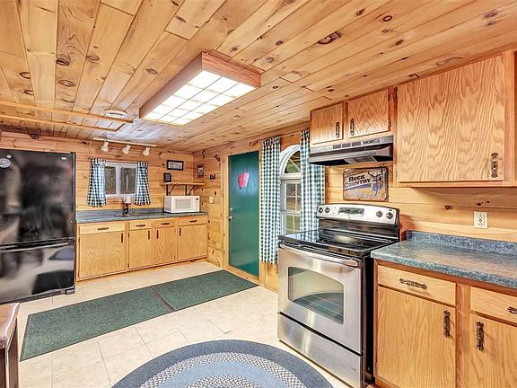 Enter into a meticulously maintained cabin