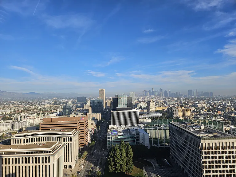 Sweeping 360_ city views _ Downtown skyline, Hollywood Hills, and endless sky.