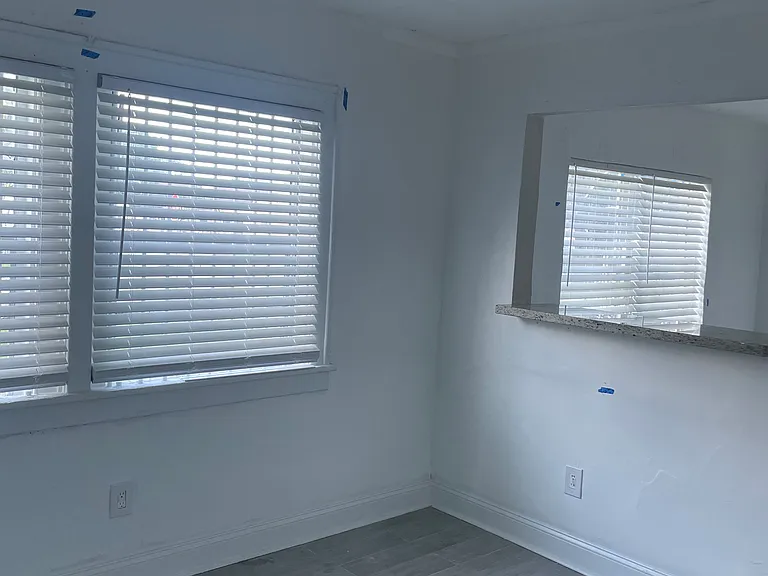 Dining room with bar over looking living room