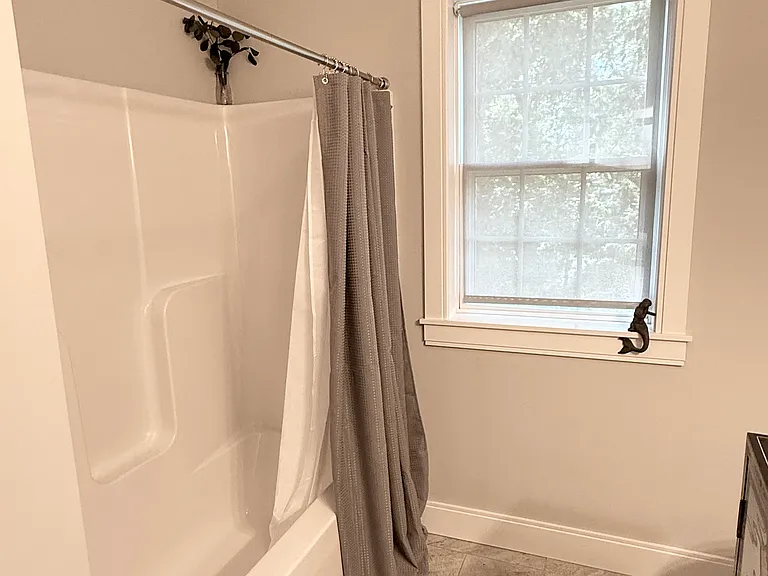 Secondary bathroom on second floor with bathtub.
