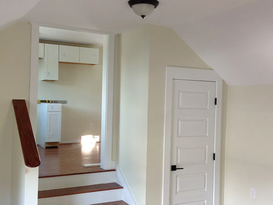 From the entry into the living room which is appox 12'x16', up the stairs into the kitchen.