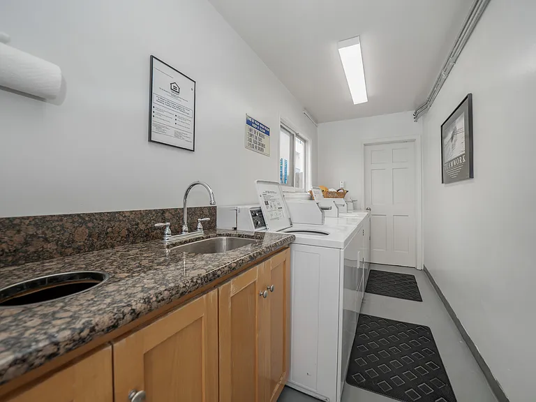 Laundry room with coin or app operated washers & dryers