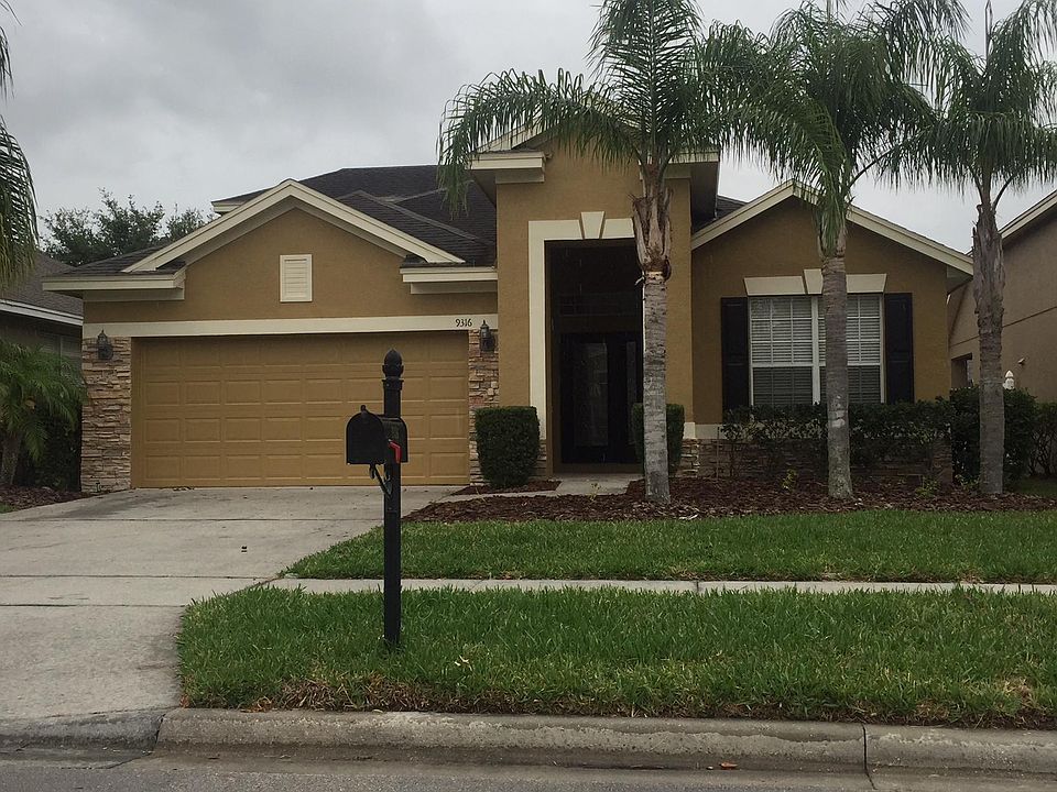 Beautiful new paint and decorated stone exterior design.