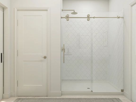Primary bath with glass-shower enclosure