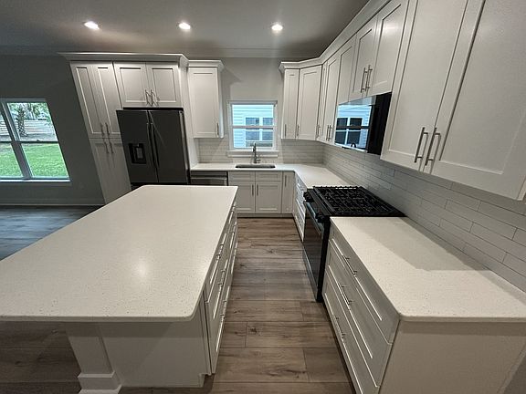 Eating space at kitchen island, ample drawers/cabinet space, large pantry cabinet