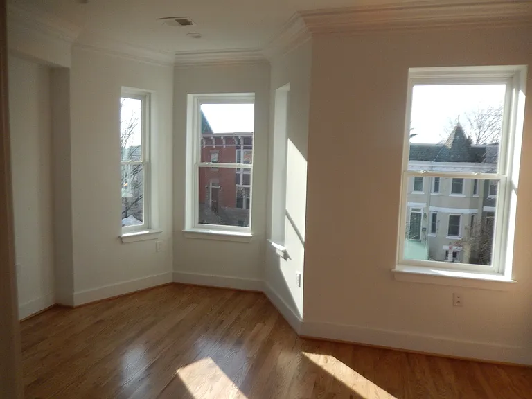 Spacious master bedroom, flooded with natural light.