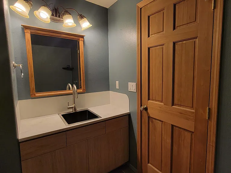 Entry to bathroom....deep sink to also wash dishes in.