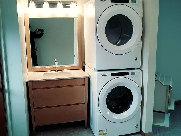 The washer/dryer and half bath are off the rec room