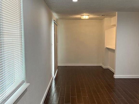 view of living room and breakfast area from front door