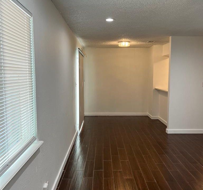 view of living room and breakfast area from front door