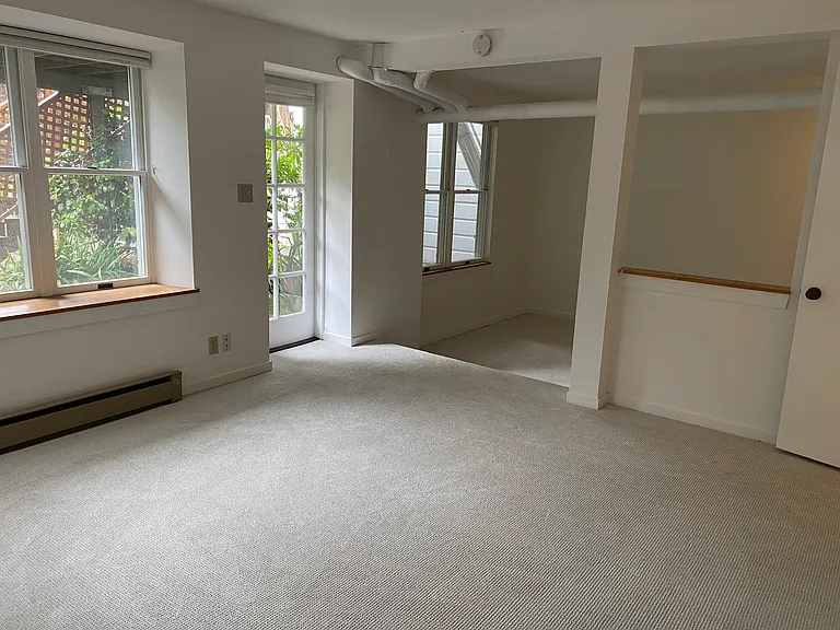 Downstairs, 2 rooms, leading out to backyard.