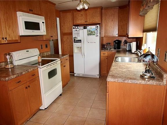 Remodeled kitchen with ample cabinets and lots of counter space for cooking.