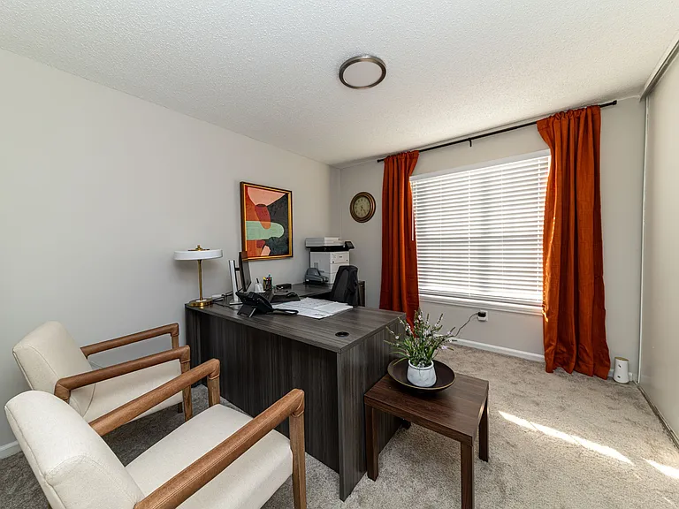 Office space with carpet and overhead lighting
