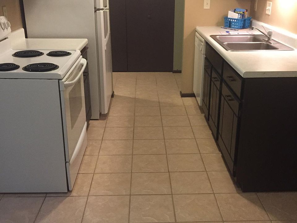 This is an image of the kitchen of a different unit with the same layout. In the unit for rent, the cabinets are painted white
