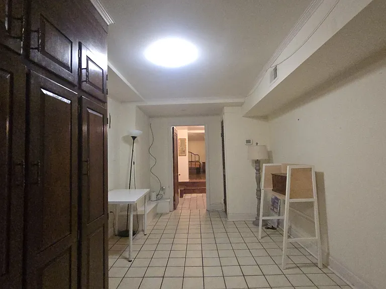 Looking down the wide hallway from the Kitched thru the bath o the Bedroom.