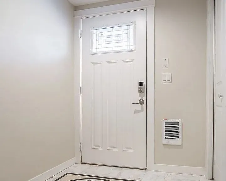 Entry with custom tile floor, coat closet and exit to garage. No dashing to the car in the rain!