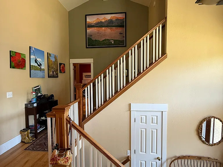 Stairs up from entry and up to master bedroom and office.