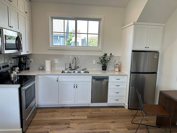 Modern kitchen appliances and stone countertops